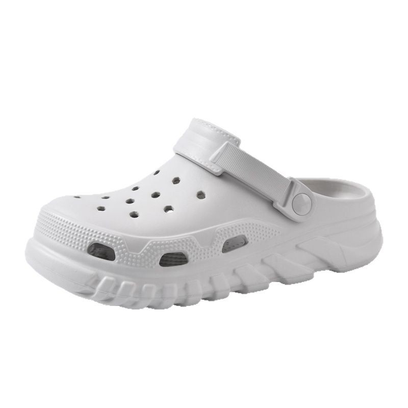 Pareja de zapatos con agujeros zapatillas frescas de verano EVA hombres y mujeres al aire libre moda ligero color sólido Baotou zapatos de playa de suela blanda al por mayor