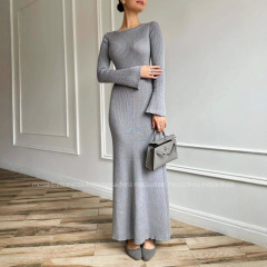 2025春の欧米の国境を越えた外国貿易の婦人服の長袖の純色の丸首のニットは腰の気質のファッションのワンピースを収めます。