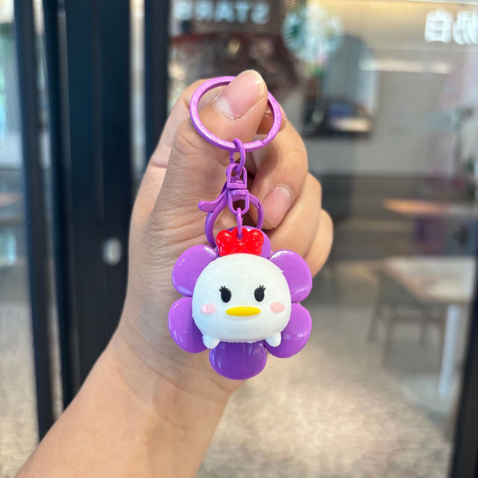 Llavero girasol-patito púrpura