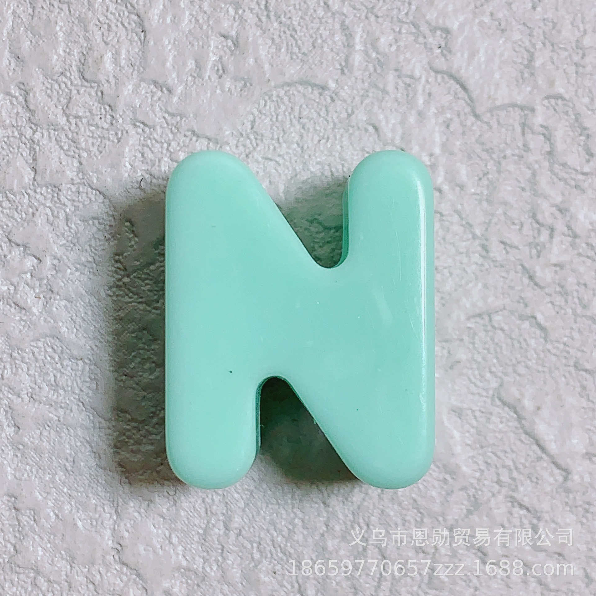 N (turquoise)