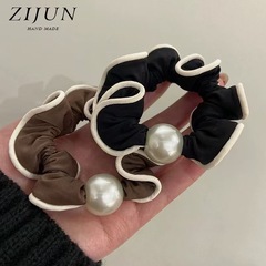 韓国版シンプルな真珠の大腸の輪の女性の新型の気質は髪の毛の縄の低い馬尾の縄のファッション的な通勤の皮の筋を刺します。