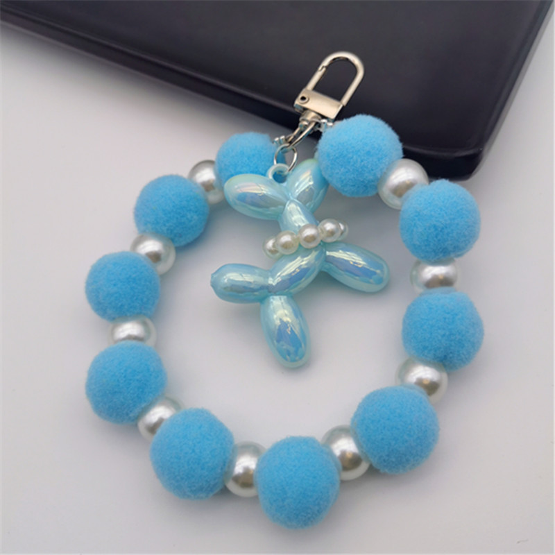 Nueva bola de piel de cadena de perlas colgante cadena de teléfono móvil ins Internet celebridad mismo estilo muñeca de invierno pulsera peluda cadena portátil