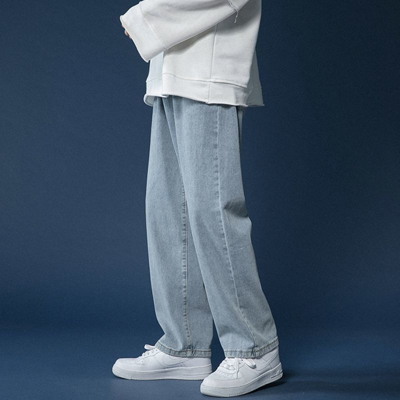 Hong Kong estilo retro pantalones vaqueros de color claro de los hombres sueltos todo partido casual de moda de pierna ancha Pantalones rectos de los hombres de la calle