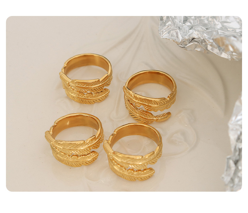 Neue Art-roll-förmigen Feder Titan Stahl Vergoldet 18k Gold Ring display picture 3