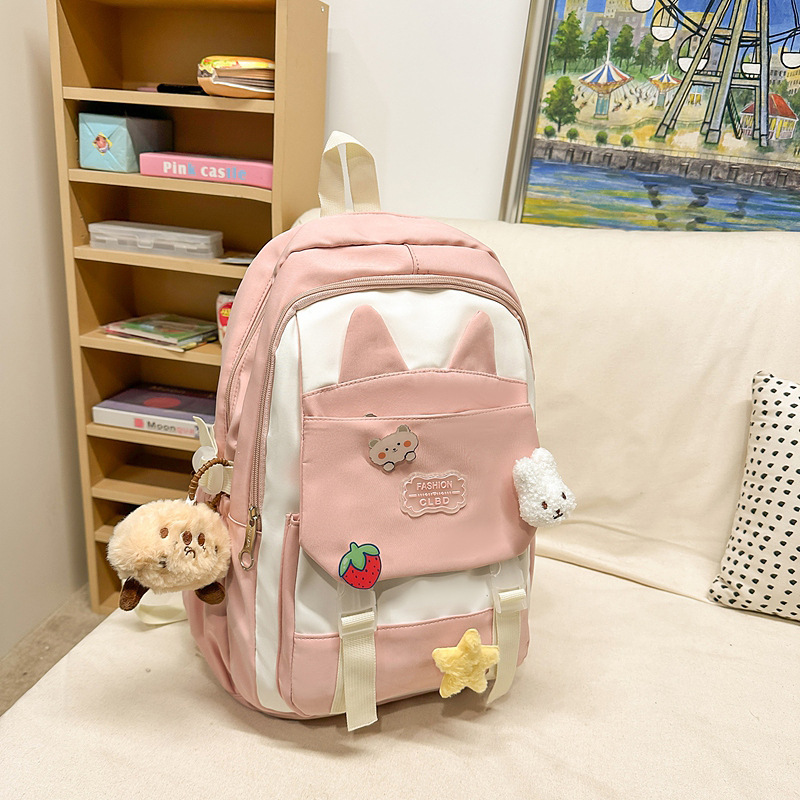 La versión coreana de las mochilas escolares de doble hombro está llena de mochilas escolares de primaria y mochilas escolares de tendencia de la escuela secundaria de gran capacidad.