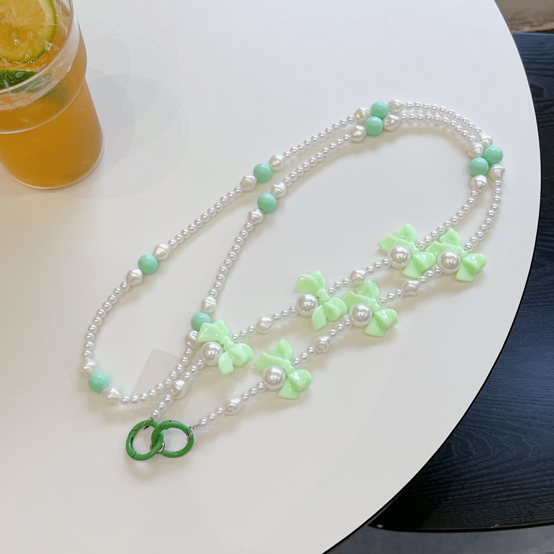 Verano color bowknot largo cadena de mensajero perla todo-fósforo bolso cadena larga cordón de teléfono móvil Xiaoqing aire fresco transfronterizo