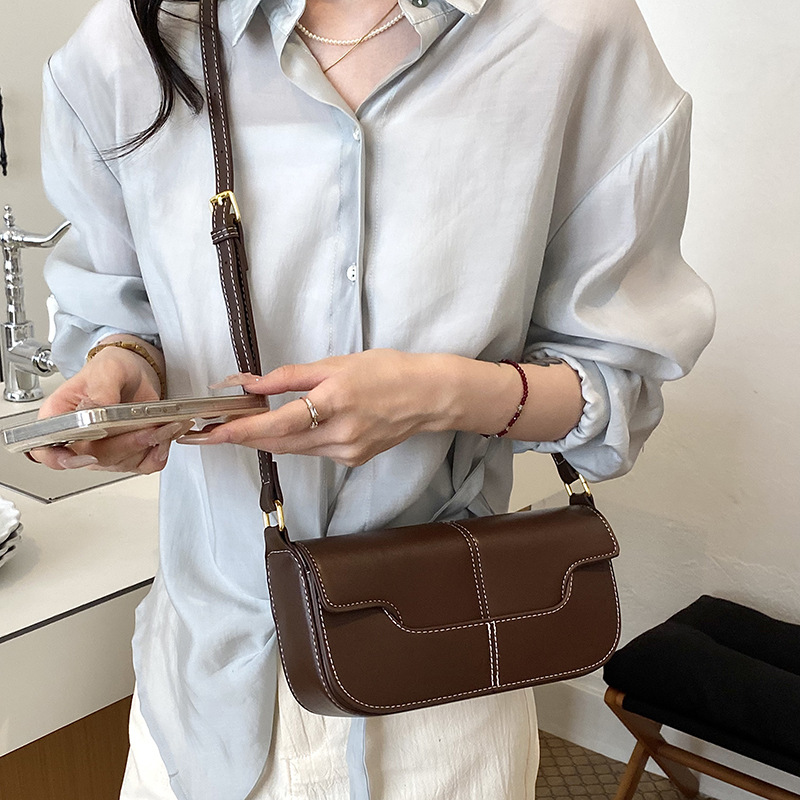 Nicho de diseño bolso de palo para mujeres 2026 nuevo estilo simple versátil bolso de hombro textura ligera de lujo bolso de mochila de moda bolso pequeño