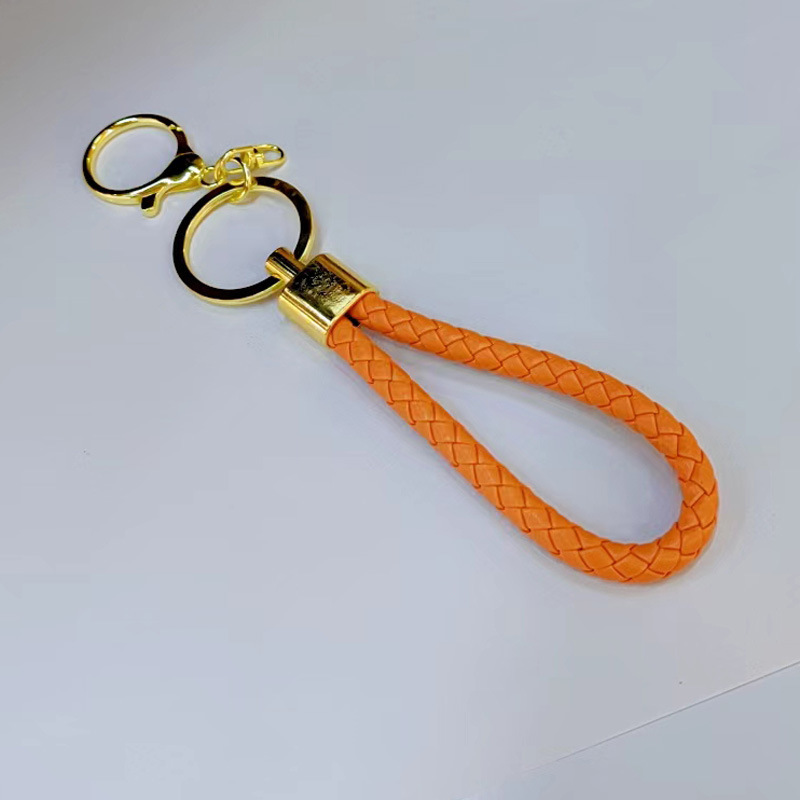 Ronda de la langosta hebilla PU cuero trenzado cuerda llavero hombres y mujeres amor llavero mano cuerda bolsa cordón fábrica directa al por mayor