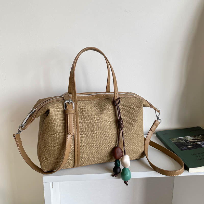 Bolsa de mano de gran capacidad de viaje coreano para mujeres 2026 nueva moda de verano simple bolsa de hombro retro