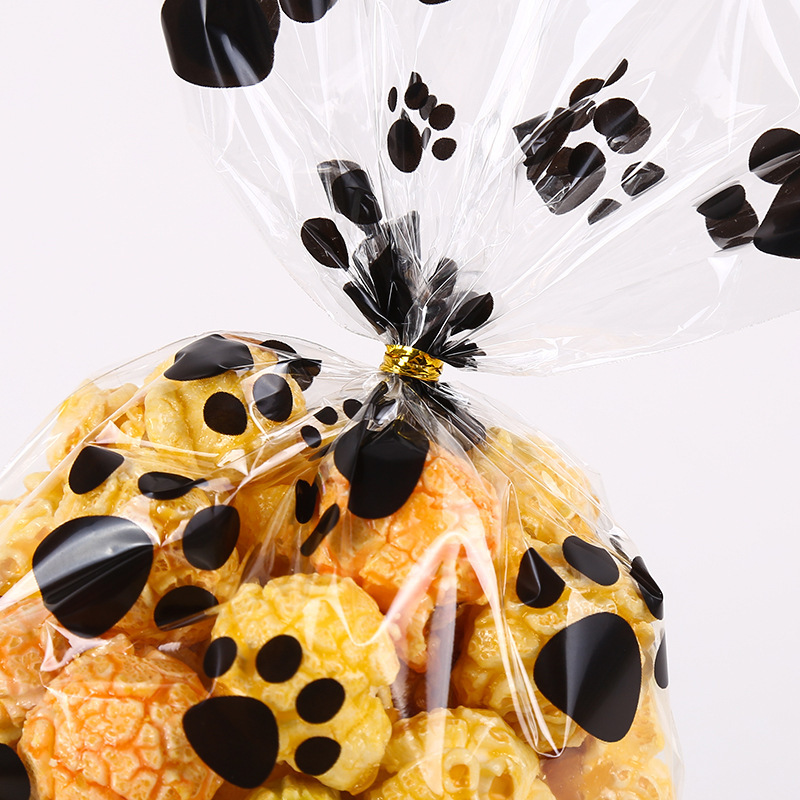OPP bolsa de papel de vidrio plano transparente huellas de cachorro bolsa de embalaje de caramelo galleta snack regalo bolsa de embalaje Alambre de lazo