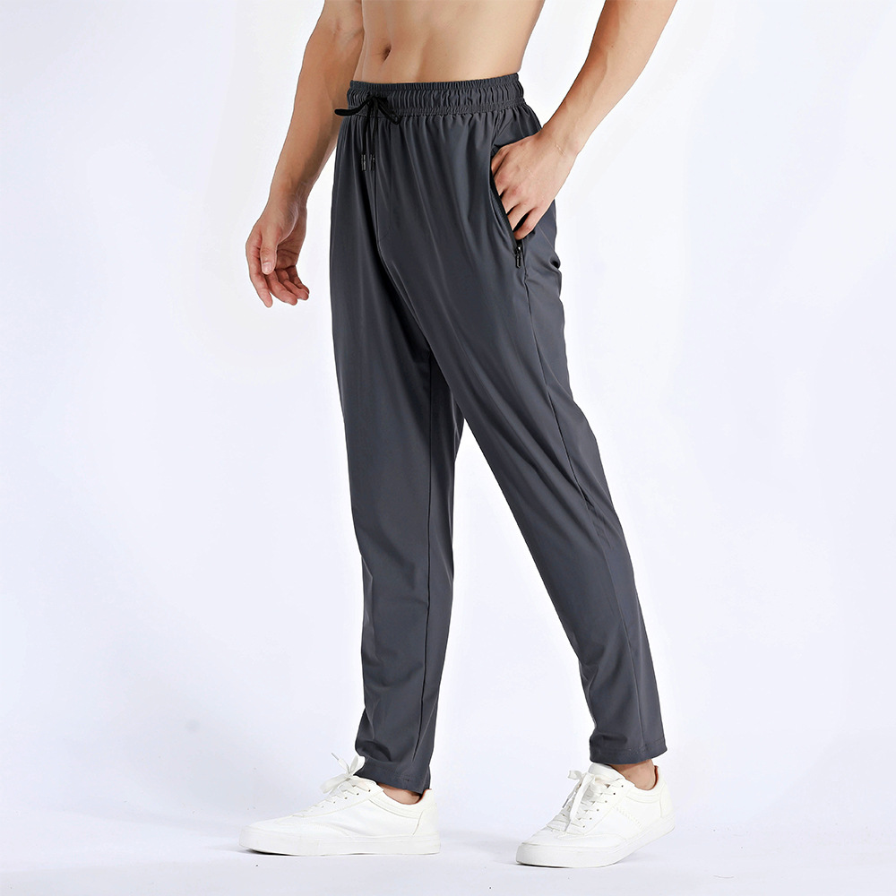 Pantalones deportivos de hombre para correr Fitness rápido secado respirado con cremallera bolsillo suelto gran tamaño de nylon hielo pantalones de cintura alta