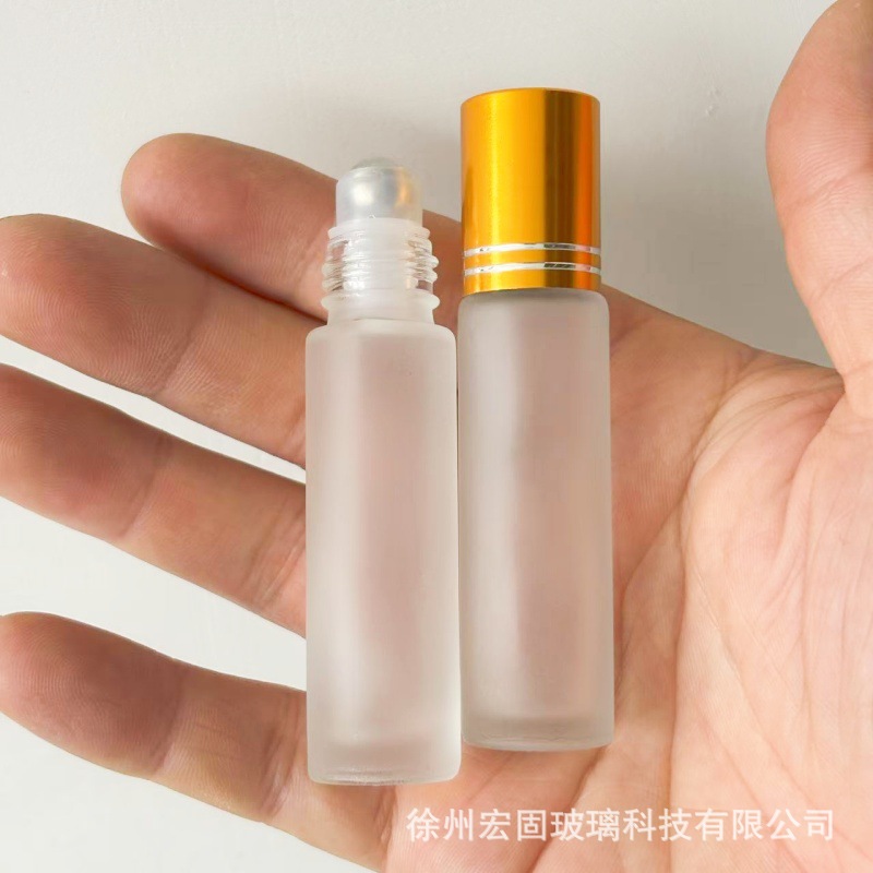 En stock al por mayor 5ml10ml botella de bola de rodillo botella de vidrio de cuentas transparente esmerilado marrón muestra de aceite esencial sub-embalaje botella vacía