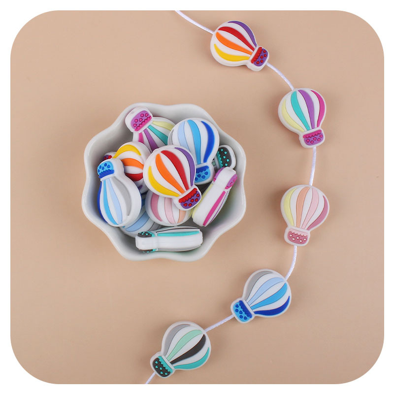Creativo DIY bebé suministros de dibujos animados de silicona color globo de aire caliente juguete mordedor bebé molar chupete cadena Accesorios