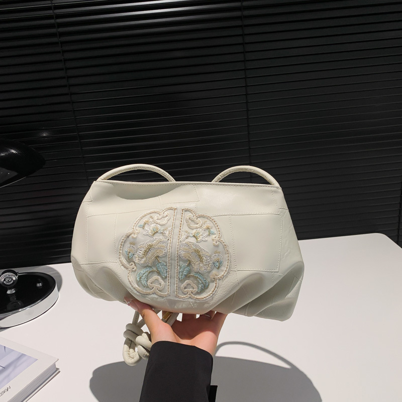 Nuevo estilo chino bordado bolso pequeño mujer 2024 nuevo plegado estilo extranjero empalme viaje al trabajo mochila de hombro