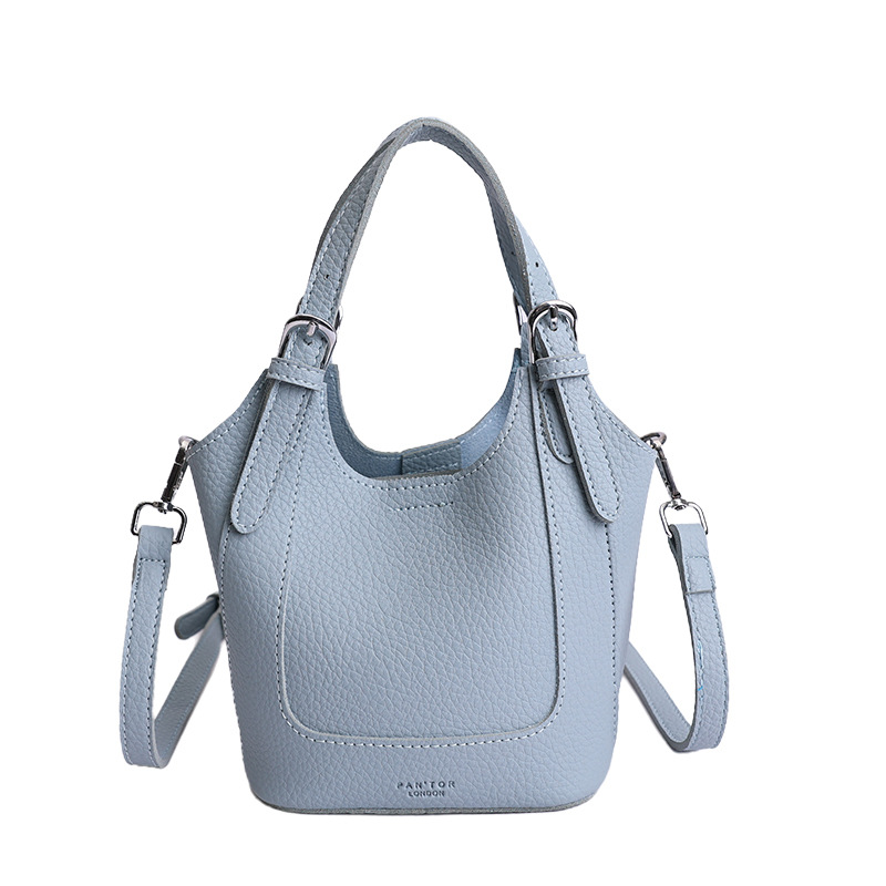 2026 nueva moda versátil cesta de verduras portátil bolso de cubo de agua de alta calidad litchi patrón ligero bolso de lujo bolso de mochila