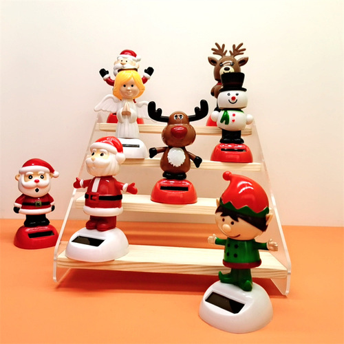Cross-border Christmas solar-powered automatic swinging doll car shaking head decoration creative car car ornaments