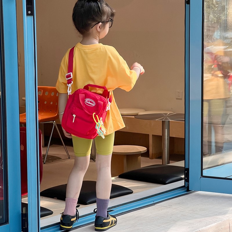 Nuevo comercio exterior bolso para niños, mini bolso simple de color sólido para bebés, bolso de cambio para viajes al aire libre para hombres y mujeres