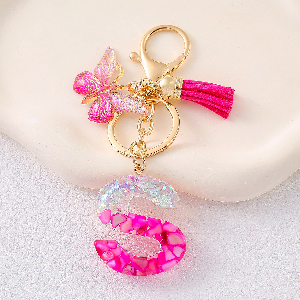 2024 explosión llavero joyería de resina letras bolsos colgantes de dama conchas rojas llavero colgantes de mariposa