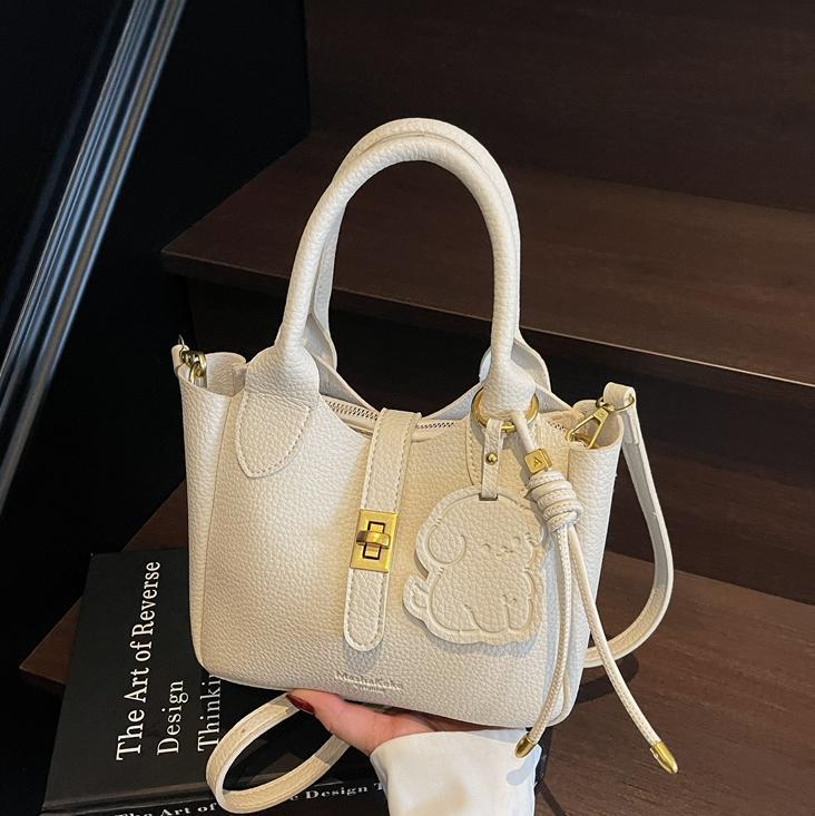 Este año, la popularidad de la bolsa de cubo para mujeres de alta calidad 2025 nuevo bolso casual de moda, bolso de hombro de moda