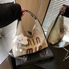 トートバッグ女性の 2025 新しい大容量通勤バックパックストリートトレンドカジュアルショルダーライトトラベルバックパック