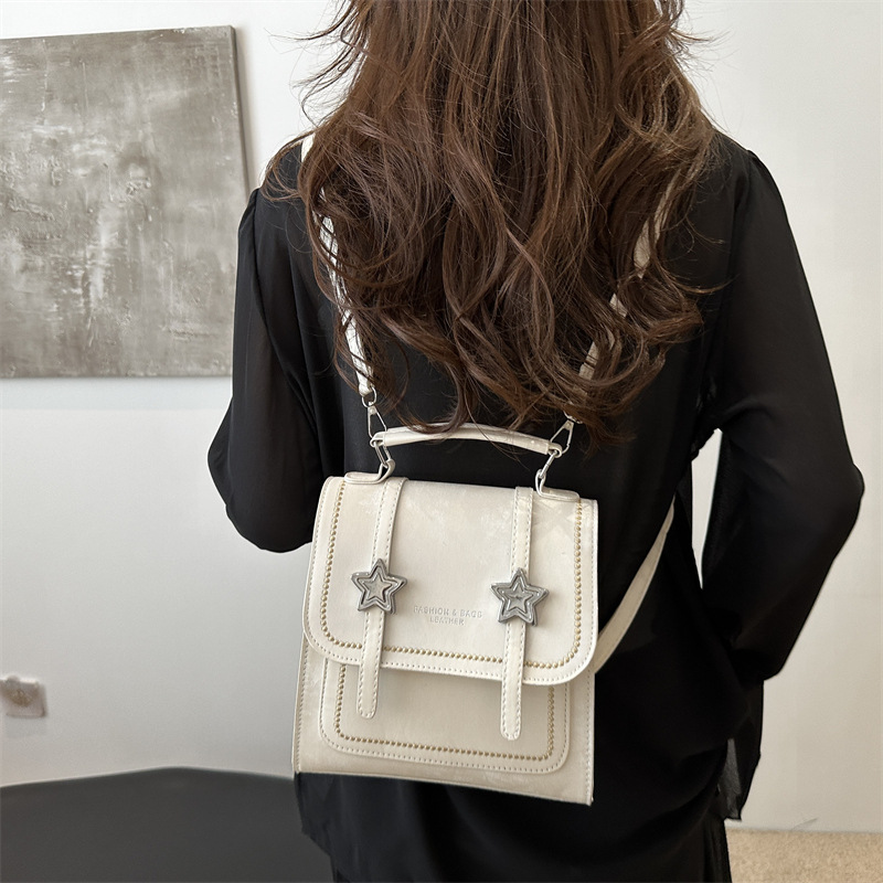 Mochila pequeña 2024 nuevo estilo de diseño de moda nicho de viaje bolsas escolares ligeras para mujeres ins para salir mochila pequeña