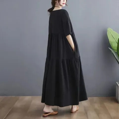 Summer fashion, artistic design for plus-size women: Large-size cotton-linen short-sleeve dress with paneling—perfect for hiding belly area, creating a slimming effect, and offering a relaxed, flowy silhouette.