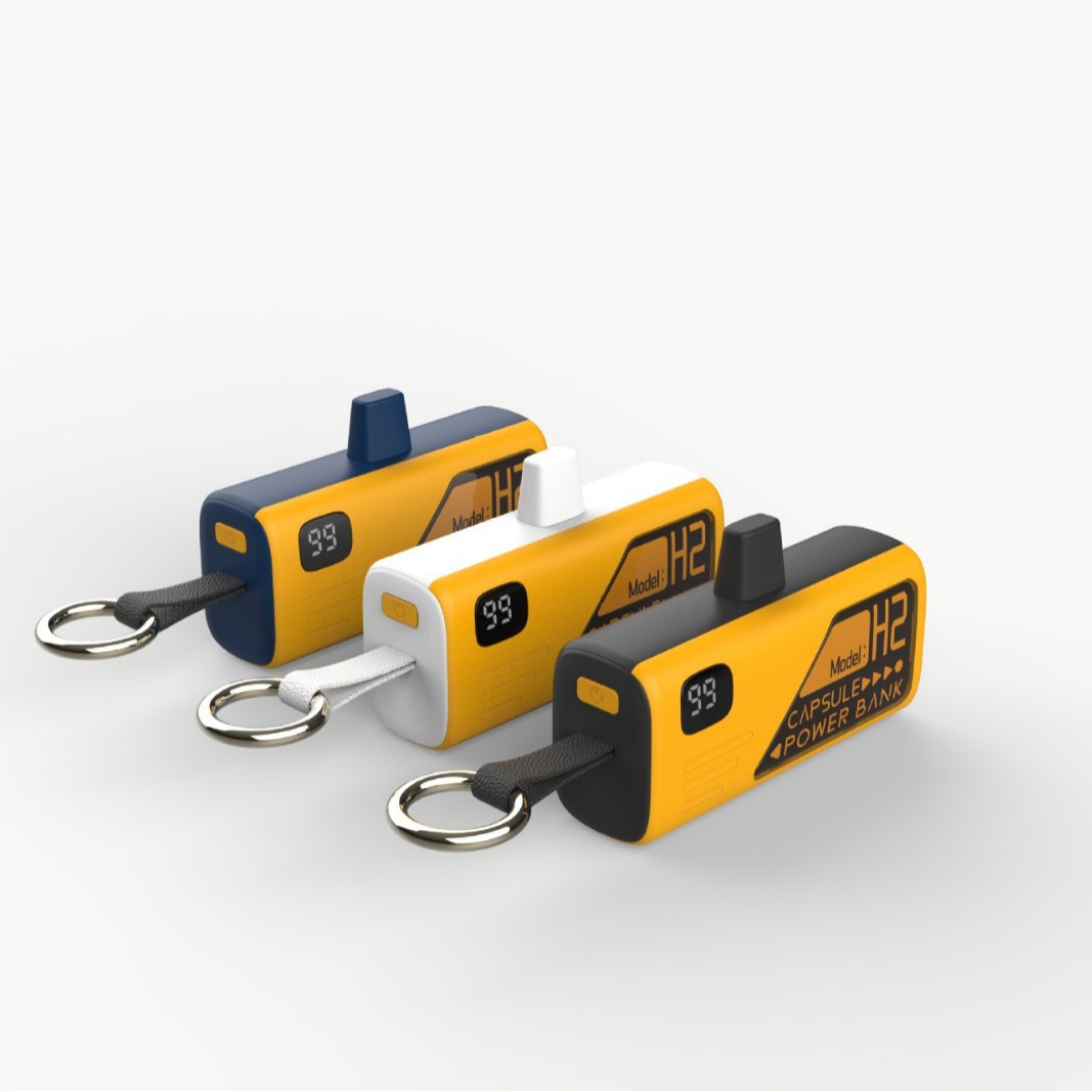 Nuevo modelo privado de puerto de carga plegable cápsula de carga 5000 mAh portátil enchufe de cola de emergencia generación de energía móvil