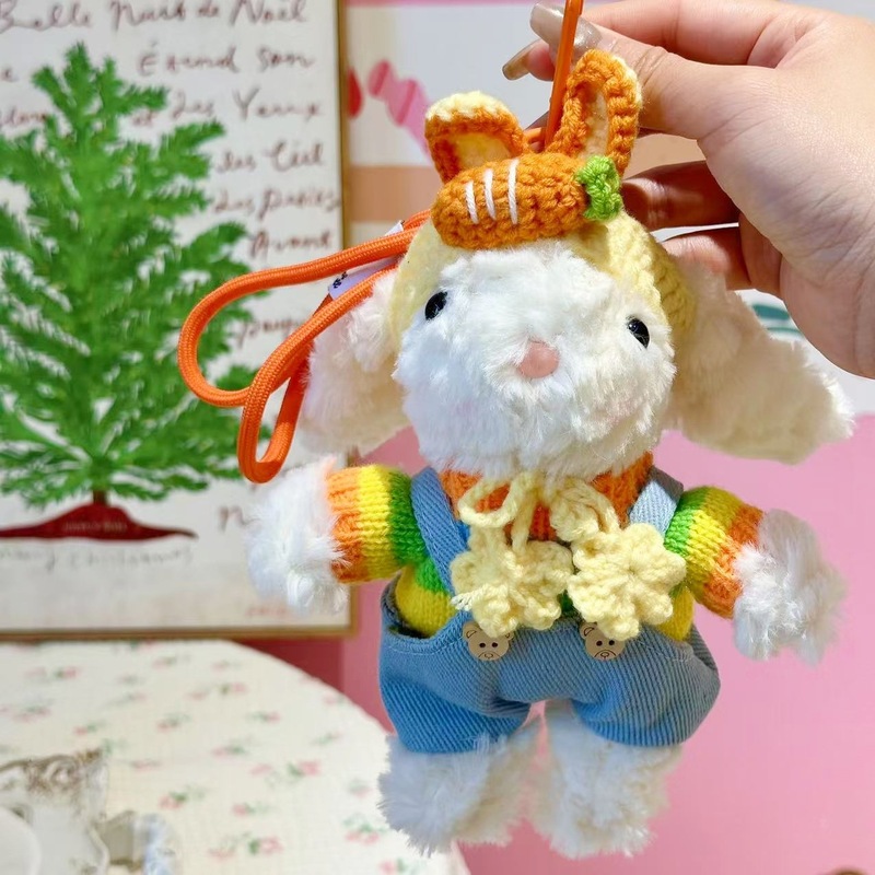 新商品の桜の耳を垂れたウサギのカバンのペンダントのぬいぐるみのキーホルダーはクリスマスプレゼントを飾ります。|undefined