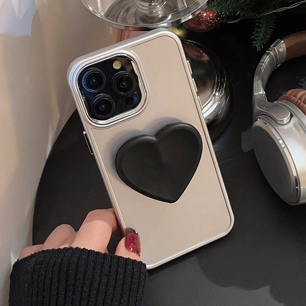 Funda para teléfono Apple iPhone 16 con soporte en forma de corazón negro 17promax, sensación de alta gama, adecuada para 11, galvanizada 12, suave 15.