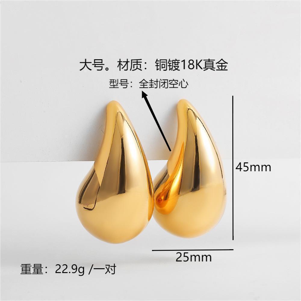 Moda europea y americana estilo caliente viento frío grande pequeña gota de agua brillante hueco 18K oro alta textura las mujeres pendientes