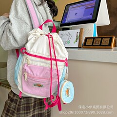 韩系撞色马卡龙色双肩包2025新款轻便可爱幼儿园书包抽绳背包批发