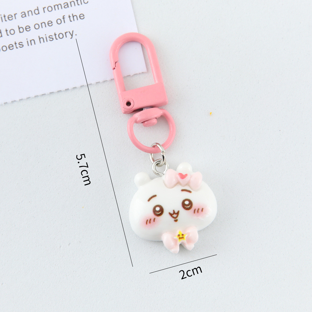 Caricatura linda corbata pequeña ocho llaveros colgantes pareja amigas bolsos colgantes de alto valor de belleza llaveros de corazón de niña