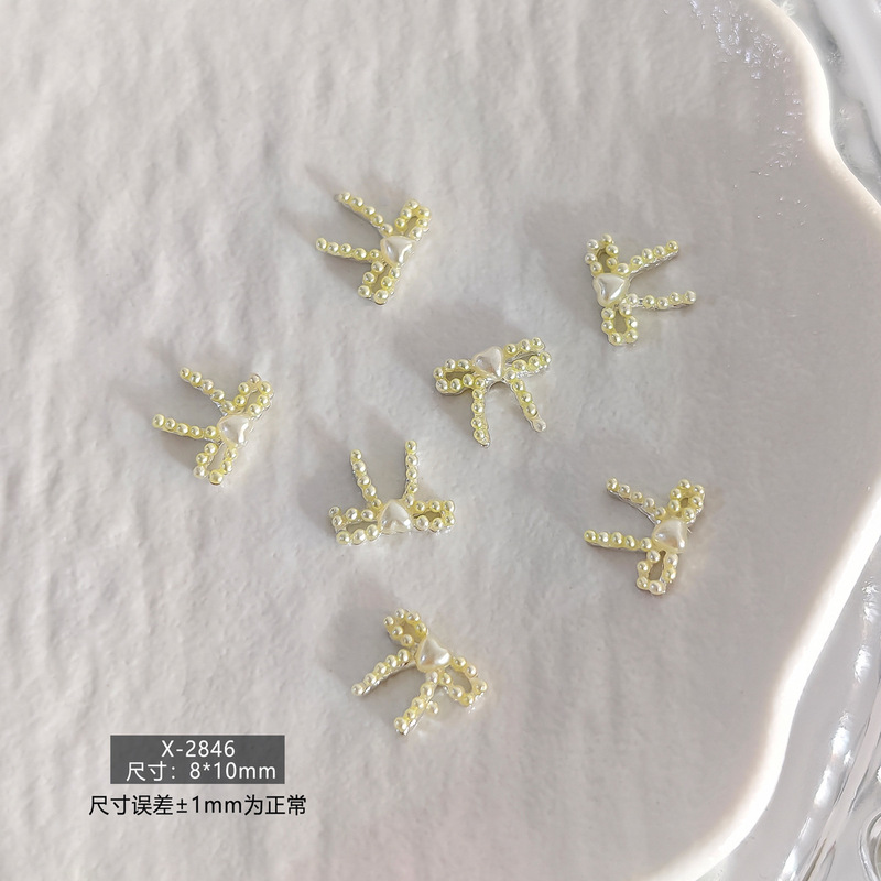 春日甜美简约日韩风珍珠蝴蝶结立体树脂美甲饰品爆款多色系指甲钻|undefined