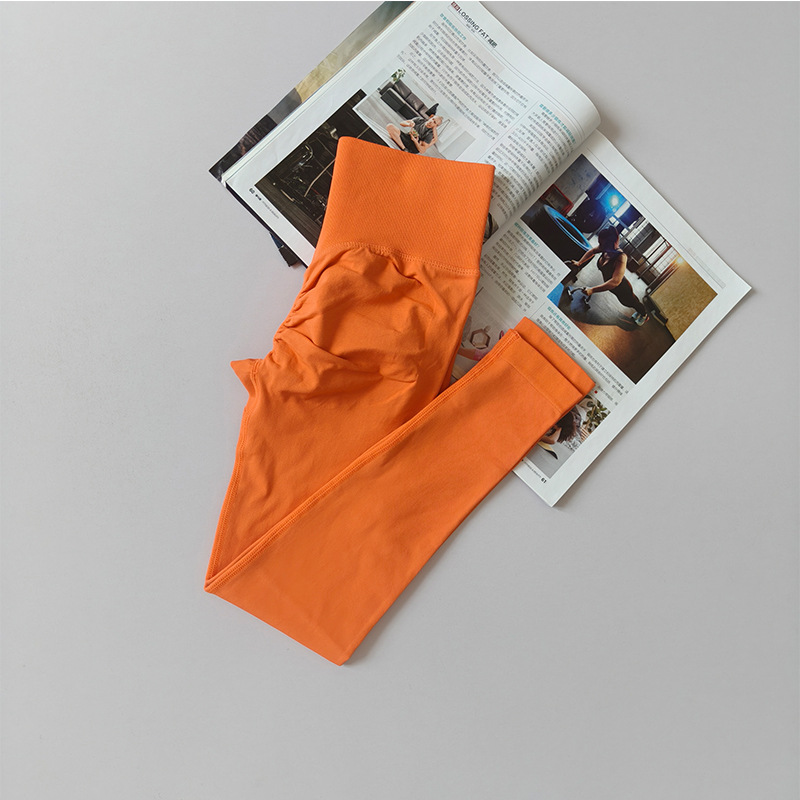 Pantalones de gimnasio sin costura europeos y estadounidenses, cintura alta, abdomen, caderas, pantalones de melocotón para correr, yoga, leggings apretadas