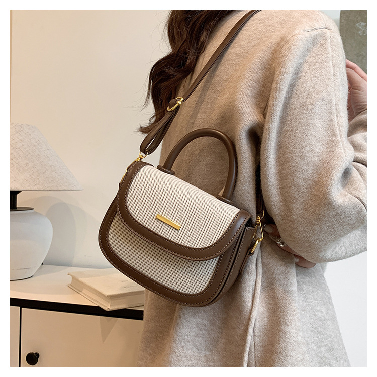 Bolsos de silla de mano de alta textura para mujeres 2026 nueva moda transfronteriza retro color contrastante empalme mochila de hombro