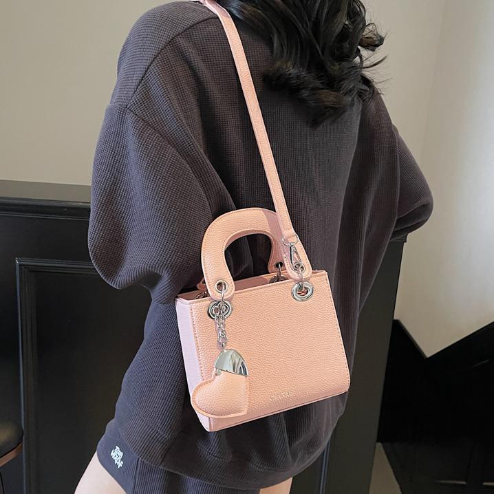 Bolso de mano de alta gama de comercio exterior para mujer 2025 nuevo bolso de hombro de todo fósforo de nicho de estilo occidental bolso de mensajero de moda
