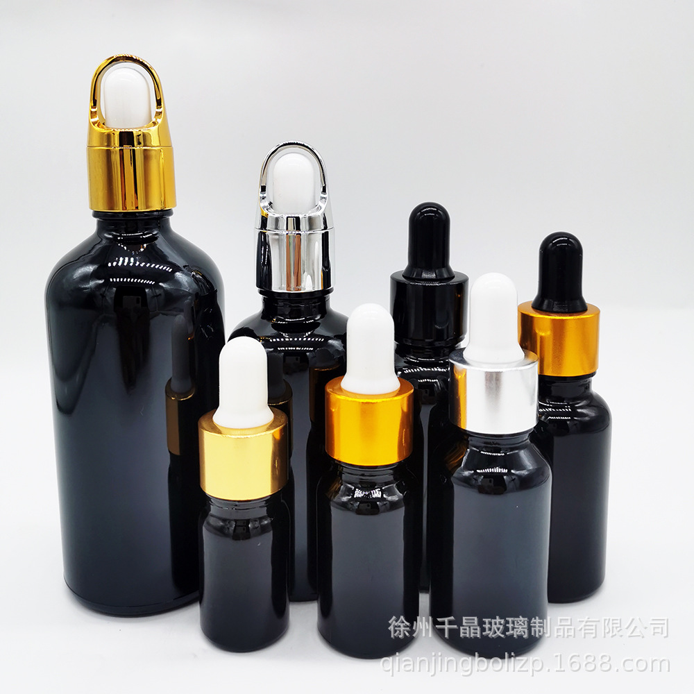 En stock botella de aceite esencial de vidrio negro brillante 5mL-100mL materia prima cosméticos negros sub-botella sombreado botella cuentagotas de cabeza de goma