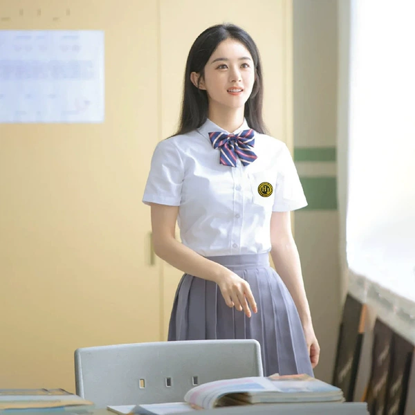 Shirt, mini-skirt, bow tie, badge