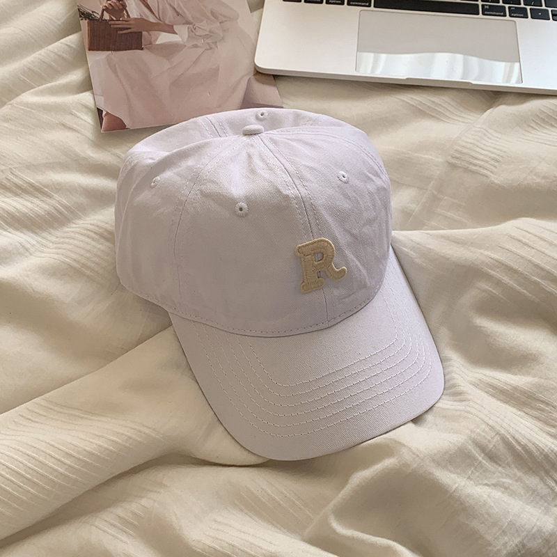 Gorra de béisbol estilo coreano circunferencia de la cabeza grande cara-mirando pequeño sombrero hombres y mujeres pareja moda todo partido letra R gorra al por mayor