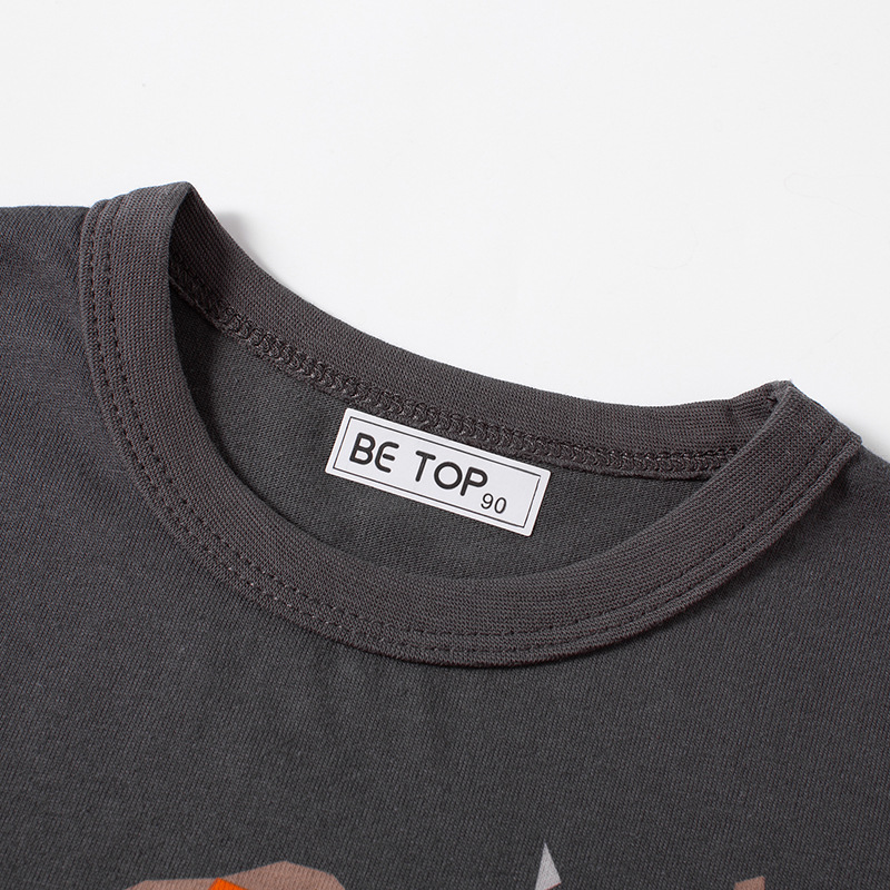 Camiseta de manga larga para niños, otoño 2025, coreana, nueva, de algodón puro, cuello redondo, con mangas con parches, ropa infantil al por mayor.