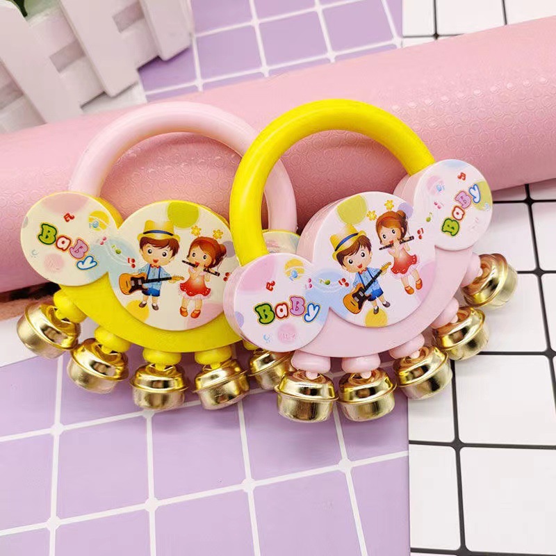 cartoon baby toddler holding rattle metal bell baby puzzle soothing baby toddler stall toys wholesale