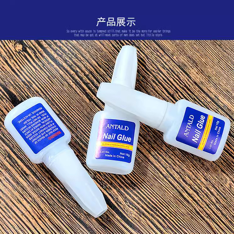 Pegamento de uñas al por mayor 10g botella azul con cabeza de cepillo pegamento de uñas adhesivo de secado rápido pegamento fuerte pegamento pegajoso pegamento de diamante protección del medio ambiente