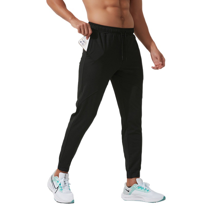 Pantalones deportivos casuales Otoño e Invierno de los hombres forrados de lana al aire libre corriendo pantalones de secado rápido tobillo-atado pantalones de deportes gruesos calientes y sueltos