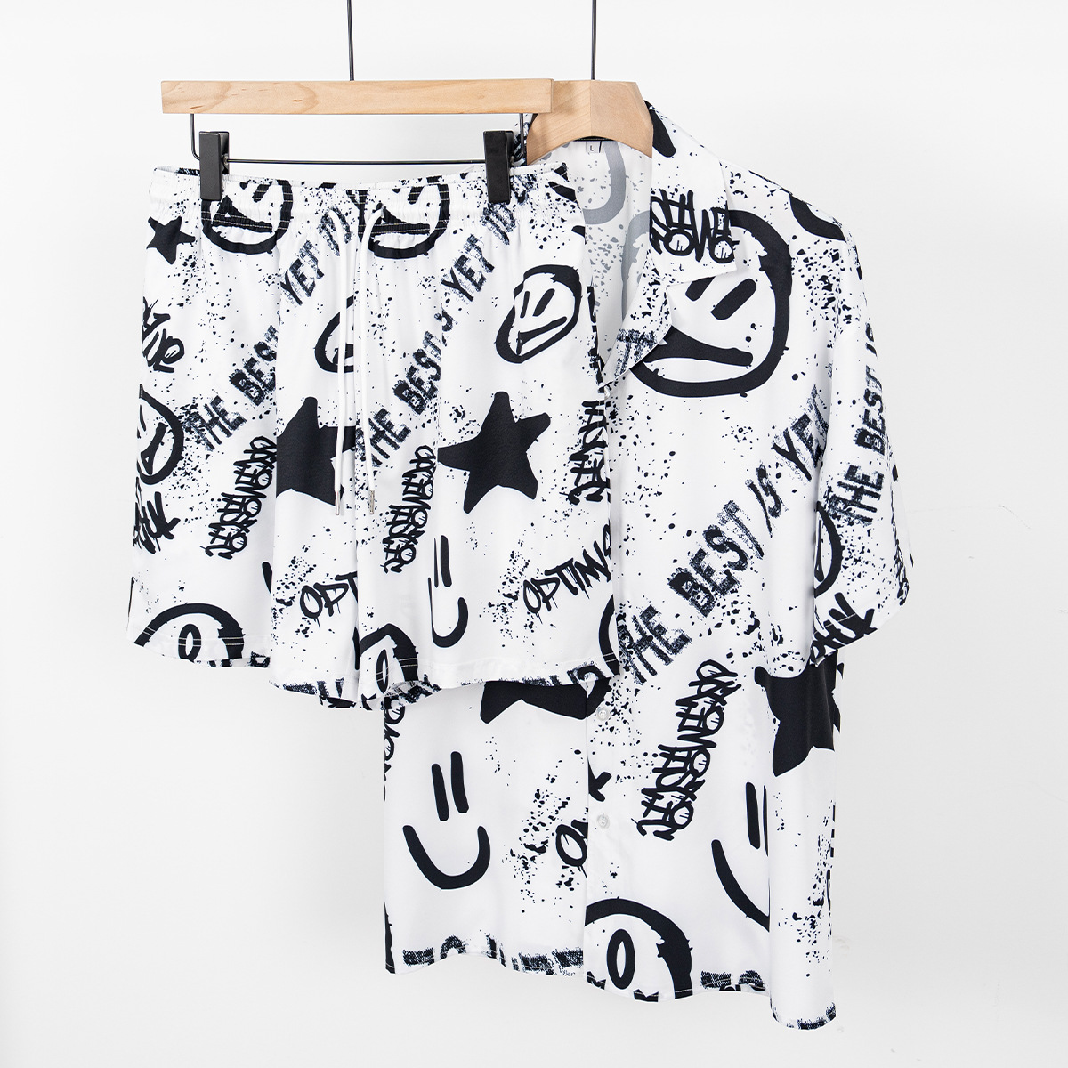 Marca de moda ropa de hombre impresa graffiti viento juego deportivo casual camisa suelta pantalones cortos de verano de dos piezas