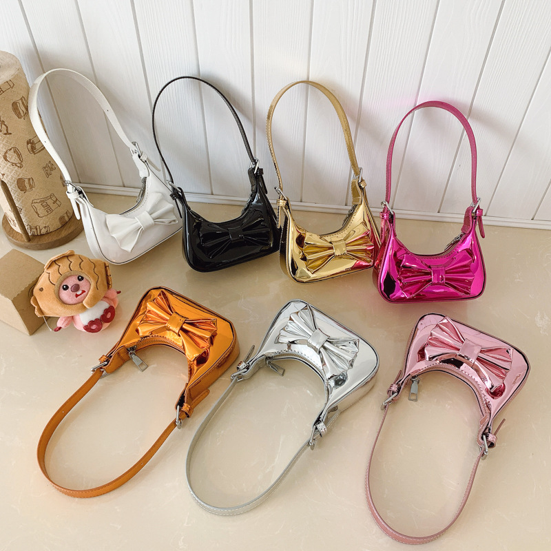 2025 nuevo bolso para niños dulce lindo arco bolso para niños espejo láser bolso de hombro para hombres y mujeres