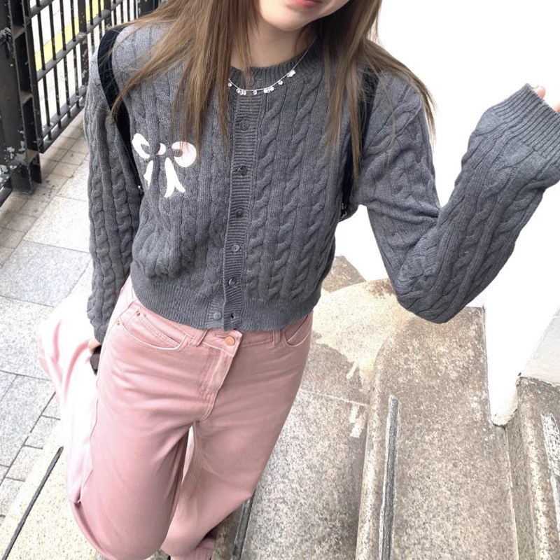 Design autumn cardigan with a round collar with bow