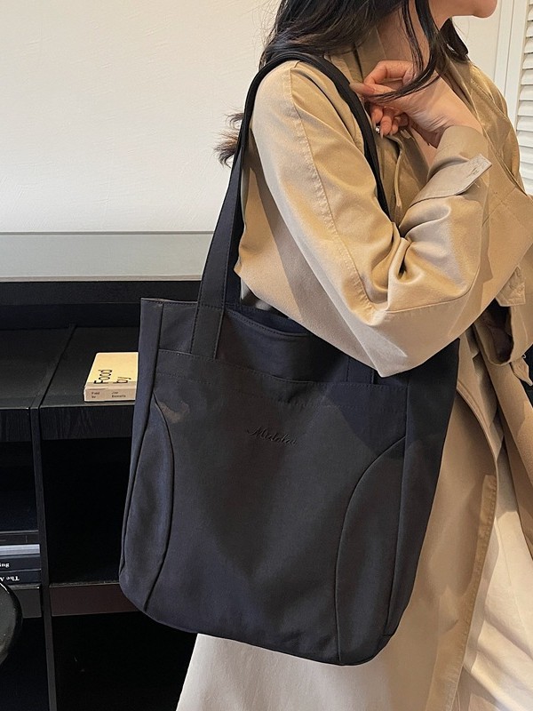 Bolsa de lona para mujeres nuevo estilo japonés retro simple de color sólido gran capacidad bolsa de transporte universal mochila universitaria