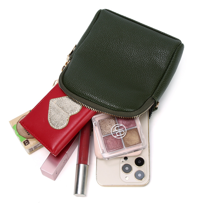 2023 nuevo contraste de color pequeño bolso redondo de lujo ligero estilo Chanel textura lychee patrón de hombro bolsa de mensajero de las mujeres bolsa de teléfono