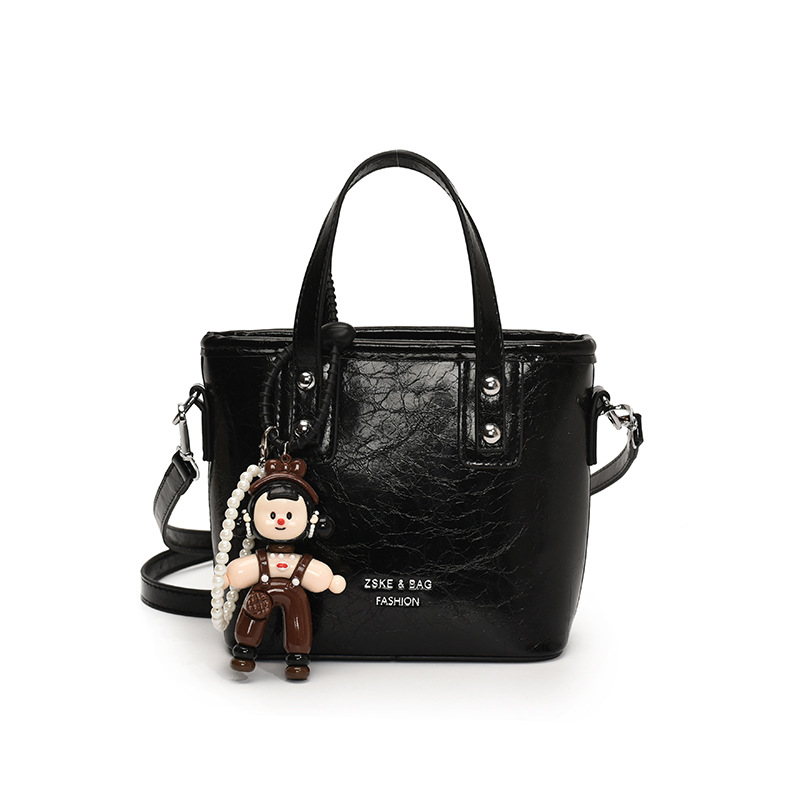 2025 nuevo nicho de moda bolso de cubo de mano para mujeres estilo coreano simple versátil bolso de hombro de moda mochila casual
