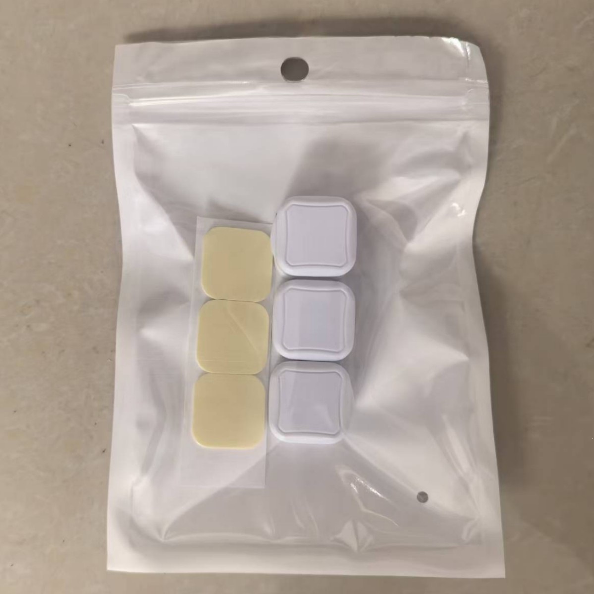 3 white pieces [packed in pearlescent film]